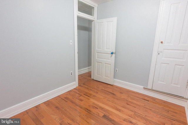 spare room with light hardwood / wood-style floors