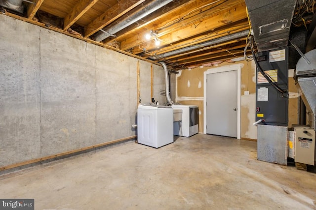 basement with washing machine and clothes dryer