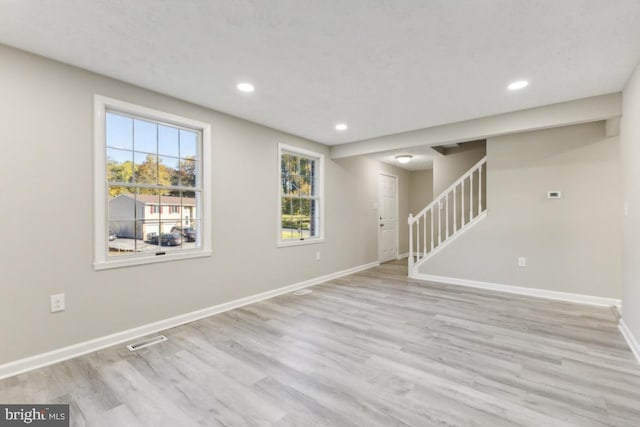 unfurnished room featuring light hardwood / wood-style floors