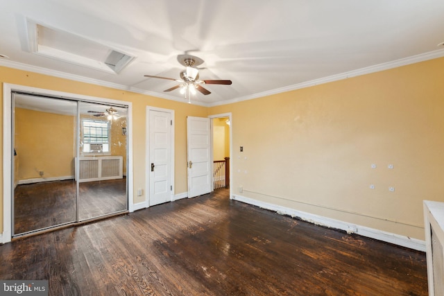 unfurnished bedroom with dark hardwood / wood-style flooring, ornamental molding, and ceiling fan