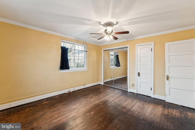 unfurnished bedroom with dark hardwood / wood-style flooring, crown molding, and ceiling fan