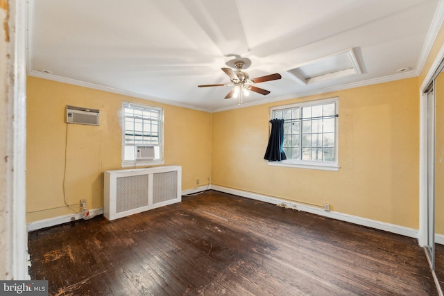 spare room featuring a wall mounted AC, ornamental molding, dark hardwood / wood-style floors, radiator, and ceiling fan