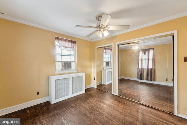 unfurnished bedroom featuring crown molding, radiator heating unit, dark hardwood / wood-style floors, and ceiling fan