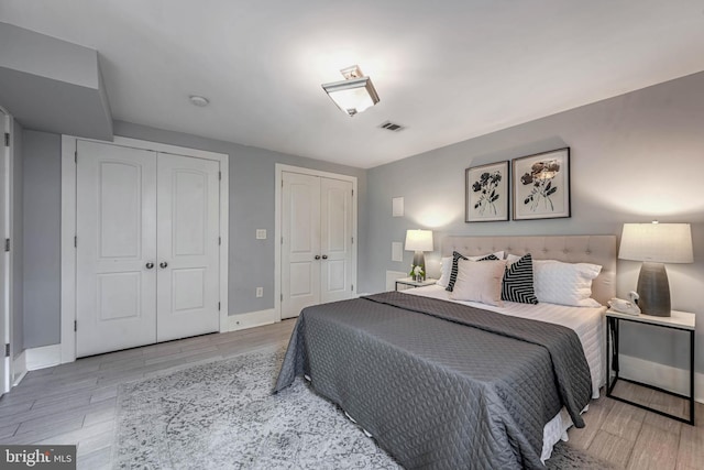 bedroom with two closets