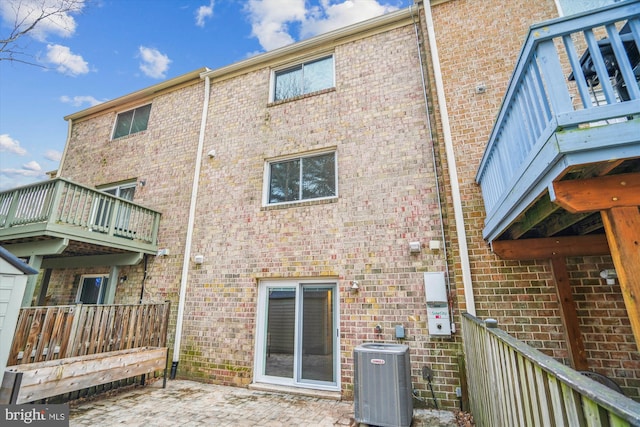 back of house featuring central air condition unit