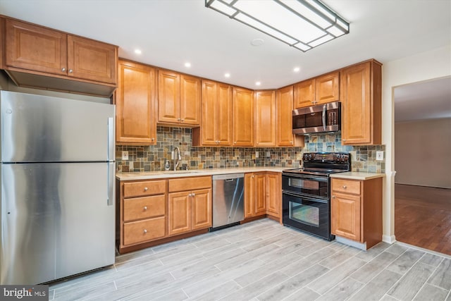 kitchen featuring sink, backsplash, and stainless steel appliances