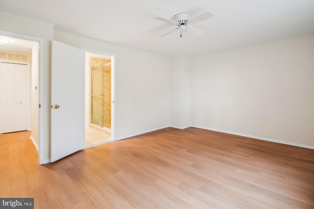 spare room featuring ceiling fan and light hardwood / wood-style floors