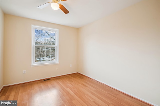 unfurnished room with ceiling fan and light hardwood / wood-style floors