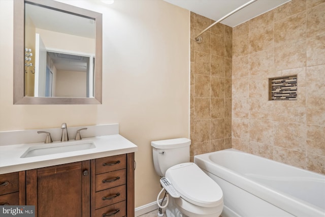 full bathroom featuring vanity, toilet, and tiled shower / bath combo