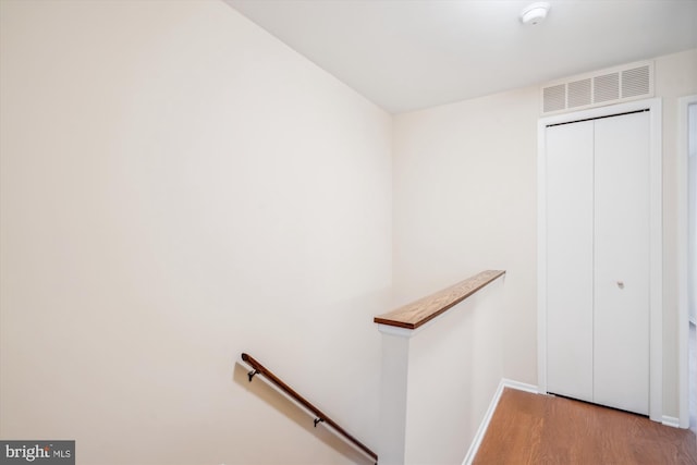 stairs with wood-type flooring