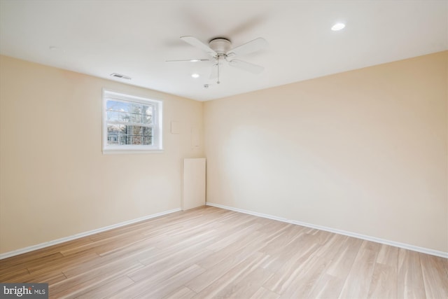 empty room with light hardwood / wood-style flooring and ceiling fan