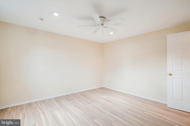 empty room featuring light hardwood / wood-style floors and ceiling fan