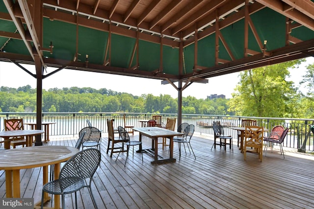 wooden terrace with a gazebo and a water view