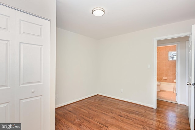 unfurnished room featuring hardwood / wood-style floors