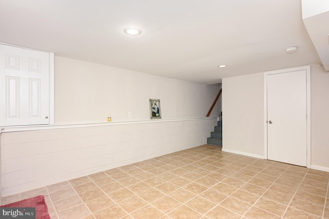 basement featuring light tile patterned flooring