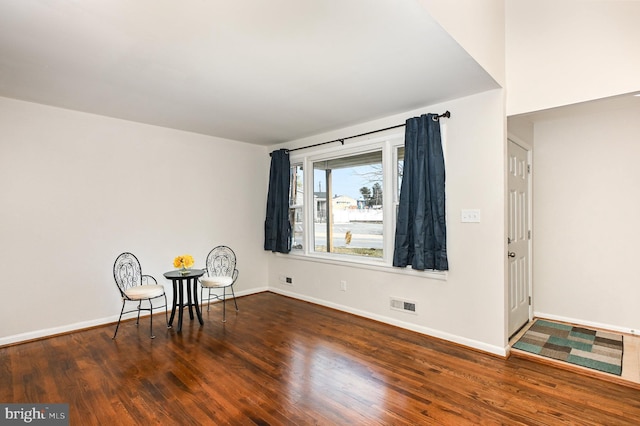 unfurnished room featuring dark wood-type flooring