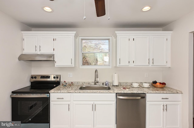 kitchen featuring white cabinetry, sink, light stone counters, and stainless steel appliances