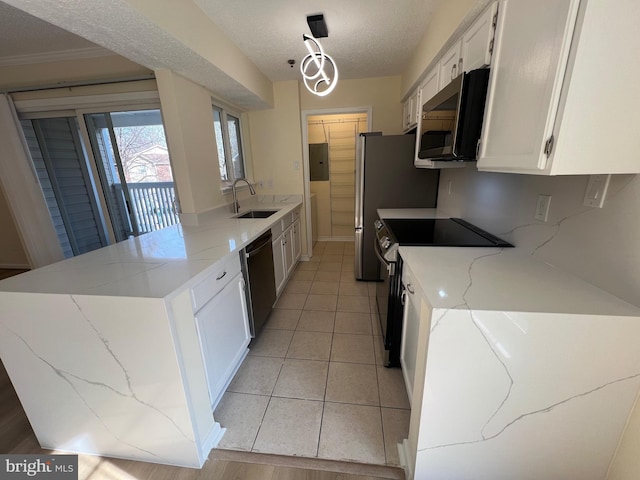 kitchen featuring dishwasher, white cabinetry, hanging light fixtures, stainless steel electric range oven, and kitchen peninsula