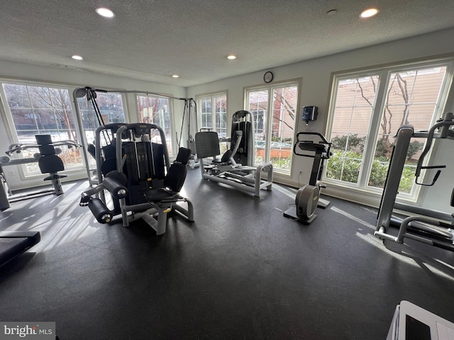 workout area with a textured ceiling