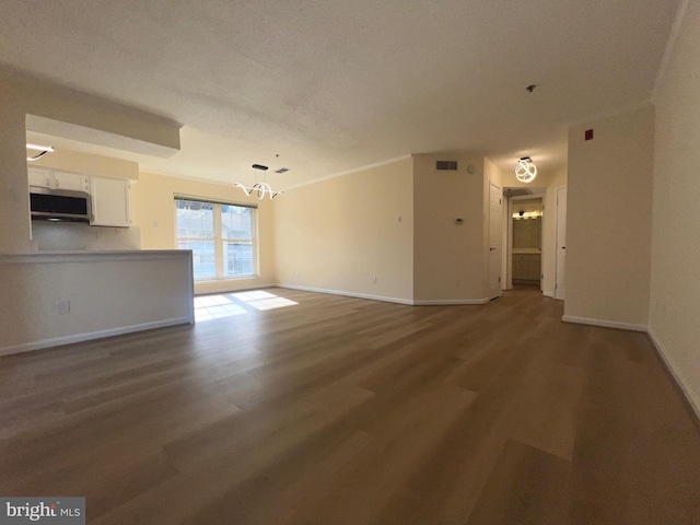 unfurnished living room with hardwood / wood-style flooring