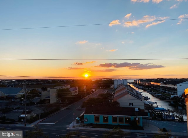 aerial view at dusk with a water view