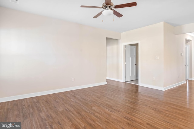 spare room with hardwood / wood-style flooring and ceiling fan