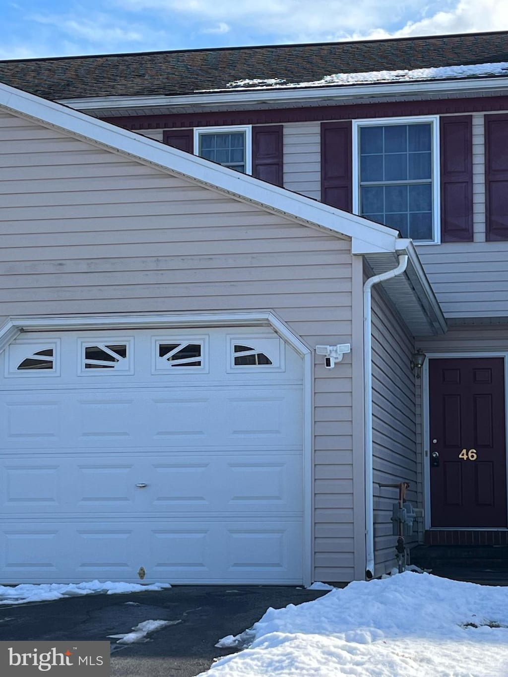 view of snow covered garage