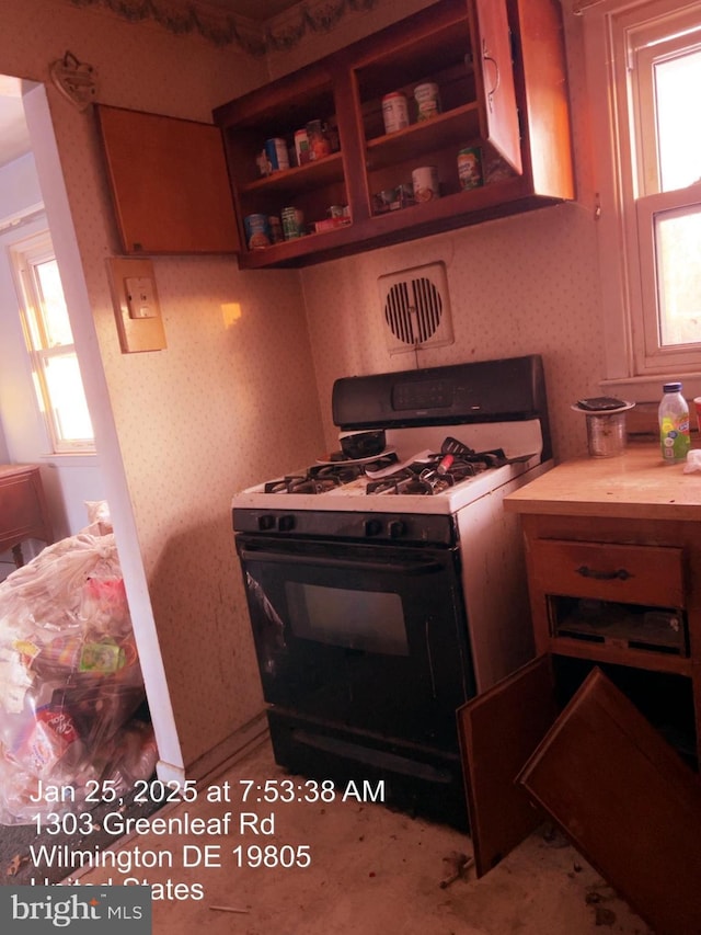 kitchen with range with gas cooktop and plenty of natural light