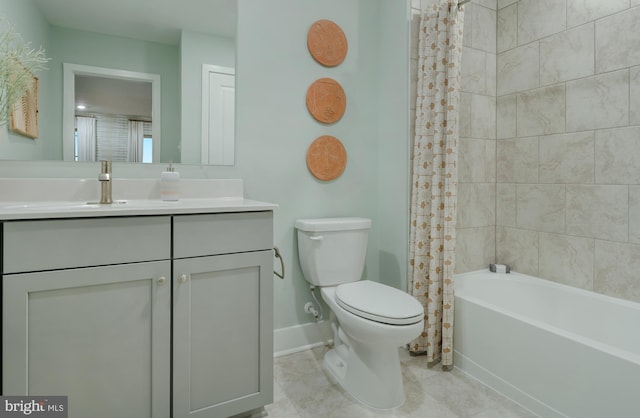 full bathroom featuring shower / tub combo with curtain, vanity, and toilet