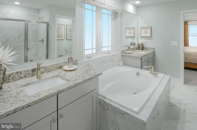 bathroom with vanity and plus walk in shower