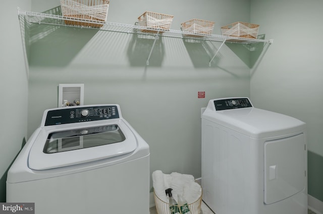 washroom featuring washer and dryer