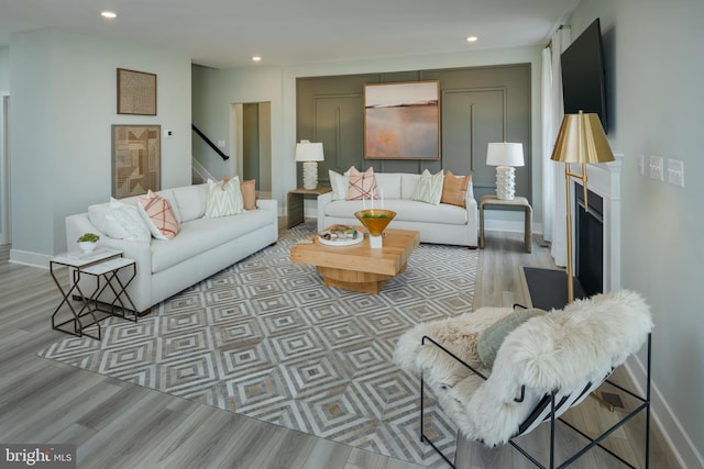 living room with light hardwood / wood-style floors