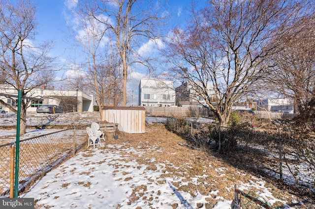 view of yard layered in snow