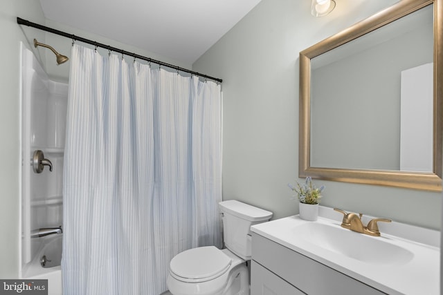 full bathroom with vanity, shower / bath combo, and toilet