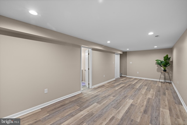 basement featuring light hardwood / wood-style flooring