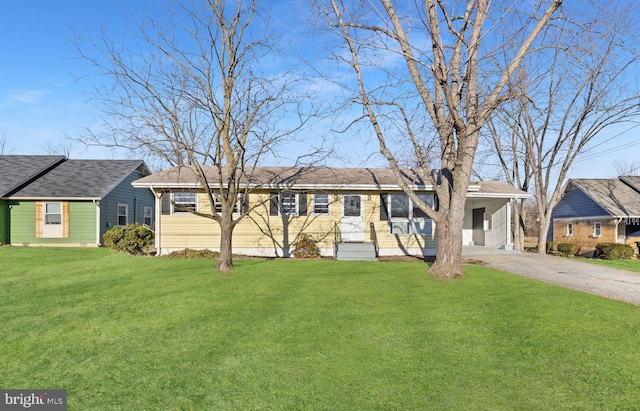 single story home with a front yard and a carport