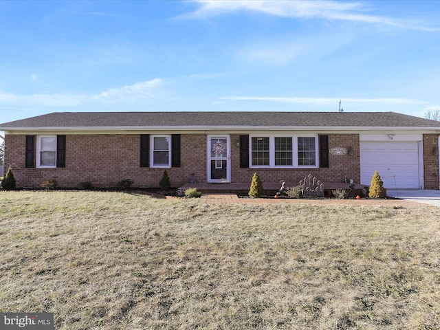 single story home featuring a garage and a front lawn