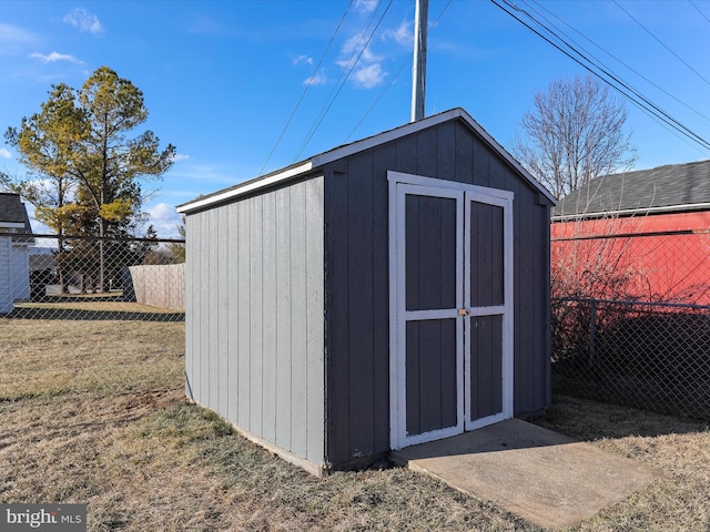 view of outbuilding featuring a lawn