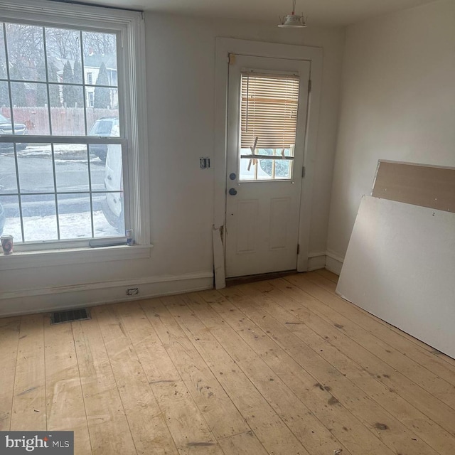 entryway with light hardwood / wood-style flooring