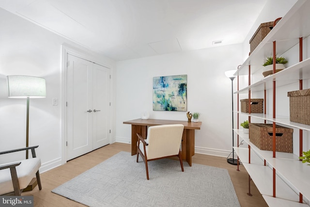 office space with light wood-type flooring