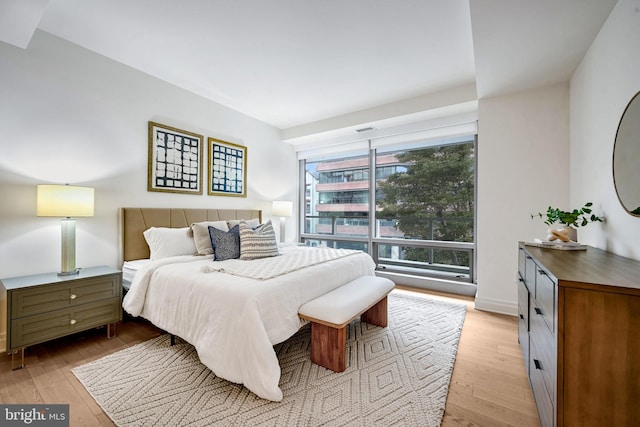 bedroom with light wood-type flooring