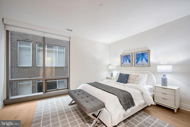 bedroom featuring hardwood / wood-style flooring