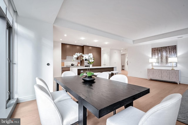 dining room with light hardwood / wood-style floors