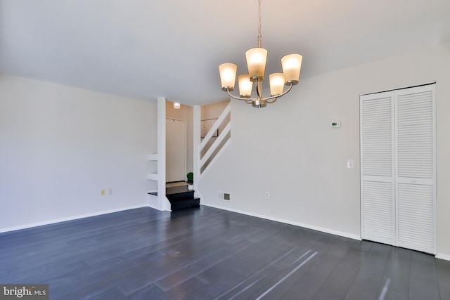 interior space featuring dark hardwood / wood-style floors and a notable chandelier