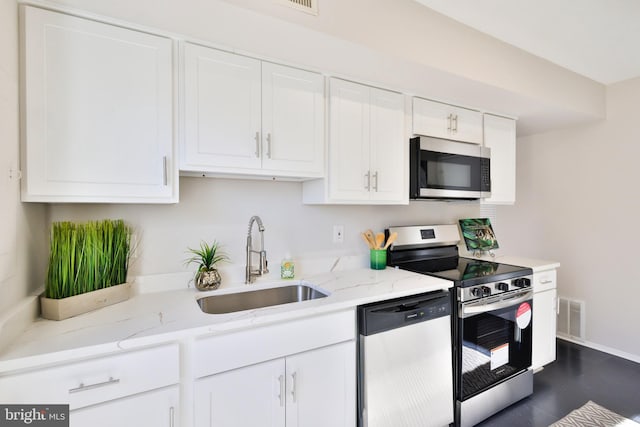 kitchen featuring white cabinetry, sink, and stainless steel appliances