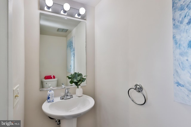 bathroom with sink and toilet