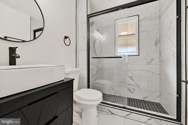 bathroom with vanity, toilet, and an enclosed shower