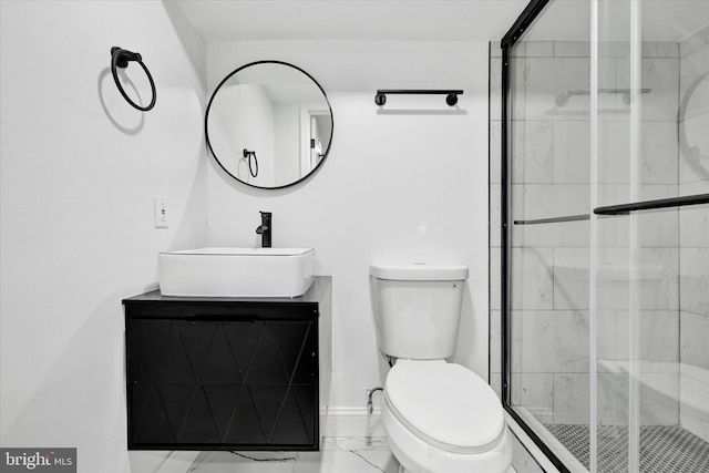 bathroom featuring vanity, toilet, and walk in shower