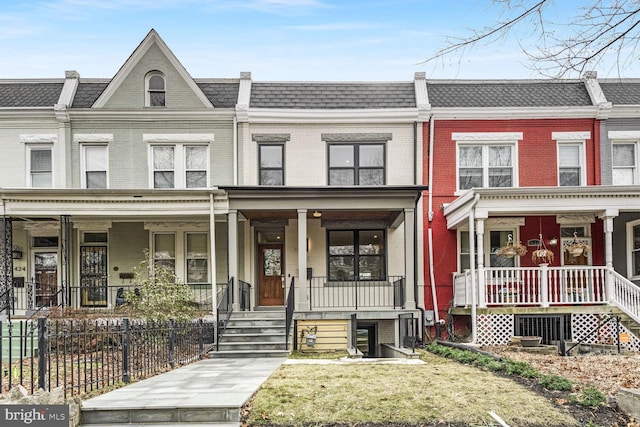 townhome / multi-family property featuring a porch