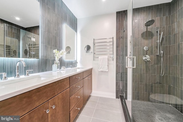 bathroom with tile patterned floors, toilet, an enclosed shower, tile walls, and vanity